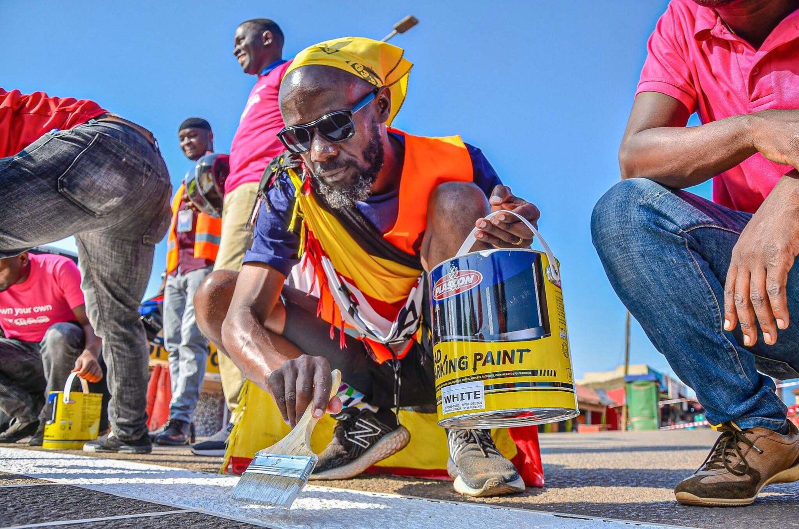 Joe Walker painting a road marking during a road safety drive